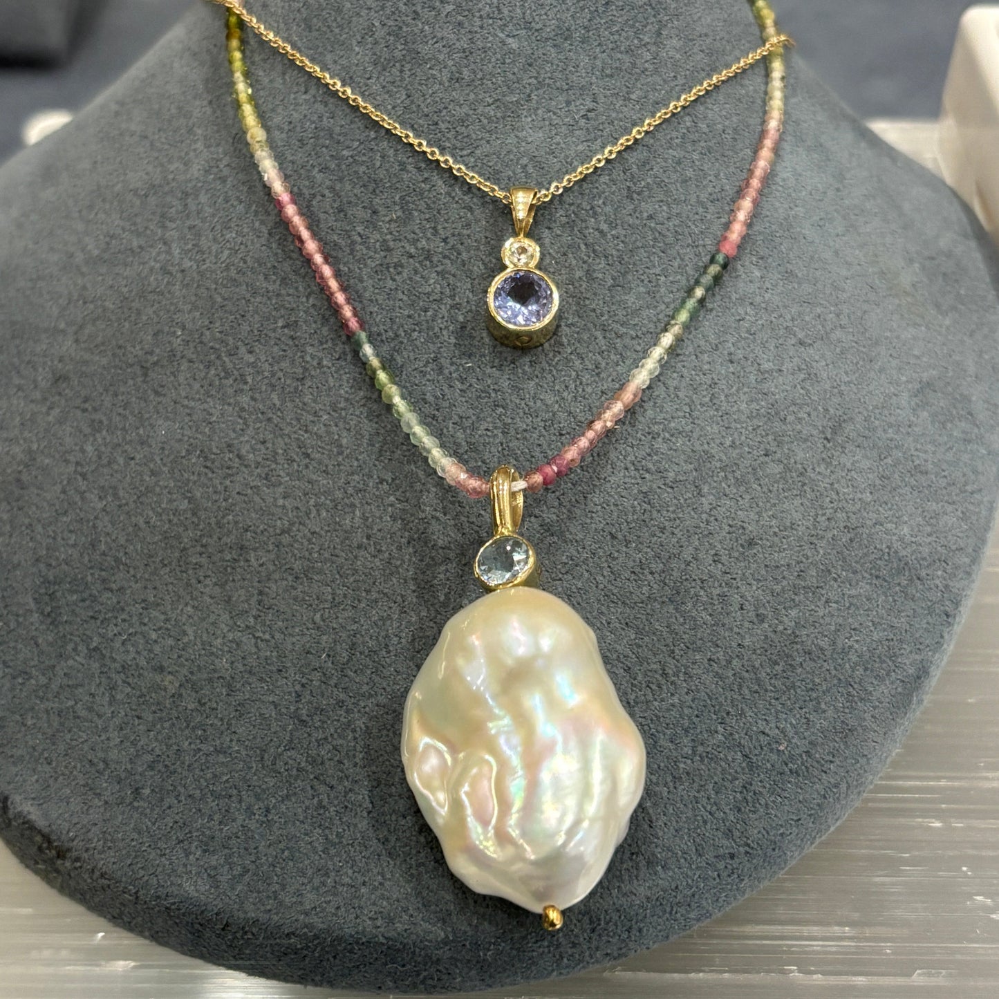 gold pendant with aquamarine and freshwater pearl