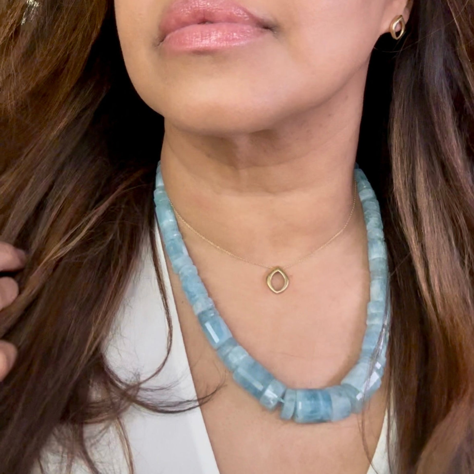 Ocean Glow Aquamarine Necklace with Flow Clasp in Gold on model