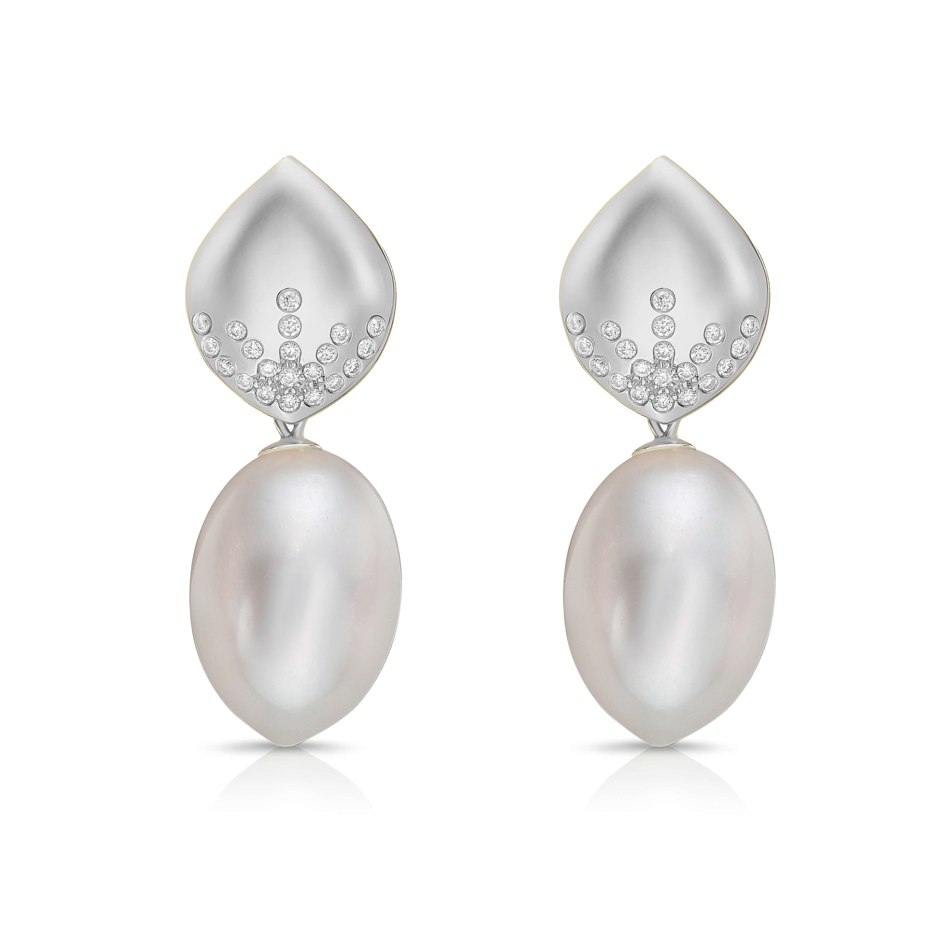 Pearl and diamond earrings on a white background