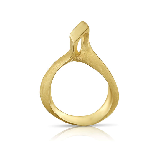 A gold pendant with an abstract design resembling arms reaching out.