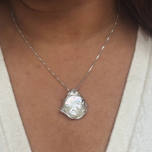 Necklace with a large, baroque shaped coin pearl pendant