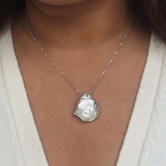 Necklace with a large, baroque shaped coin pearl pendant