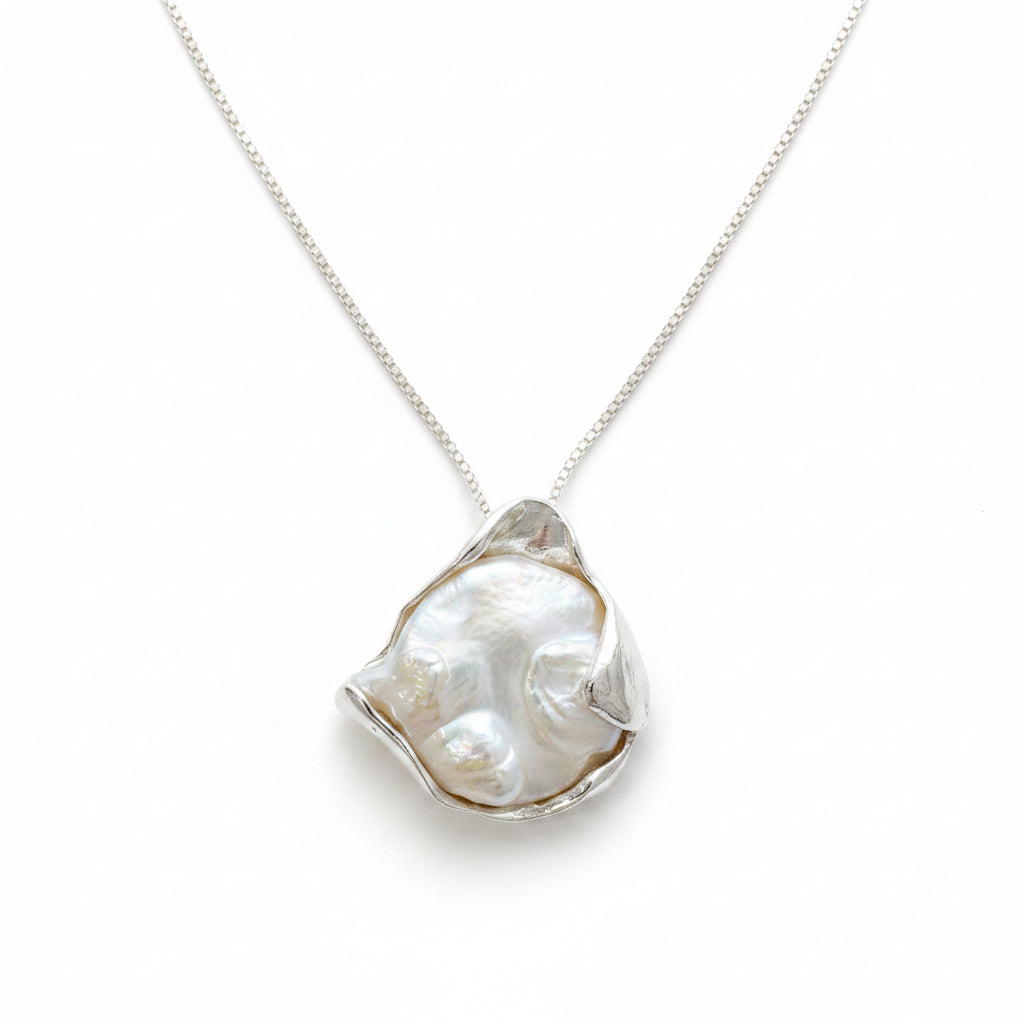 Necklace with a large, baroque shaped coin pearl pendant