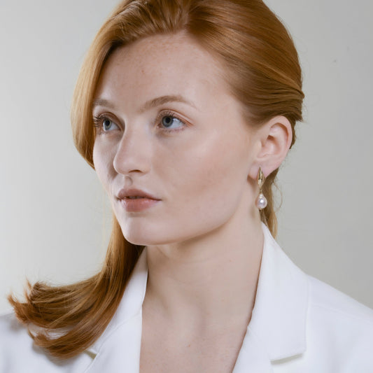illicium-baroque-drop-earrings-in-gold-on-model