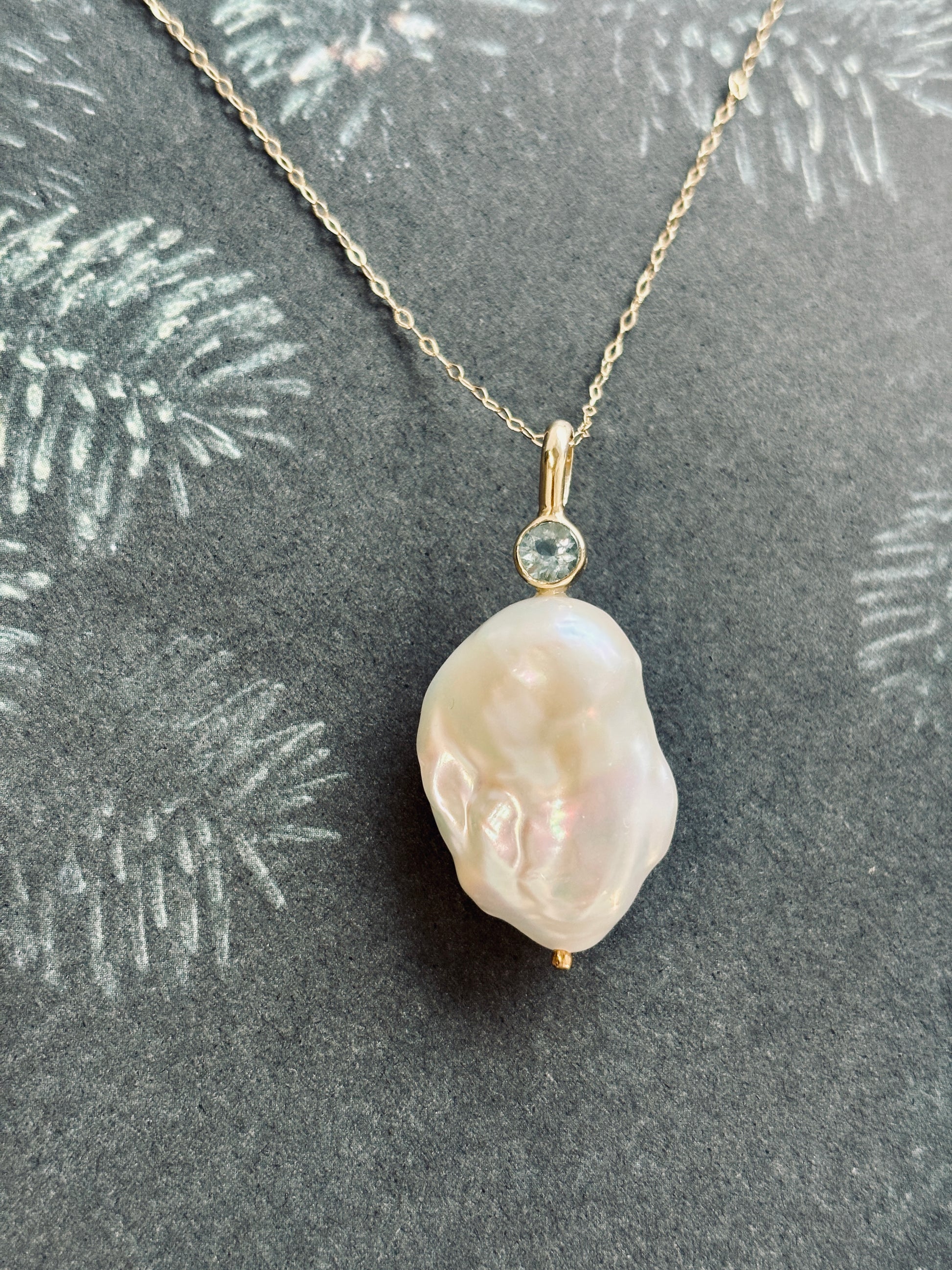 Gold pendant with aquamarine and fresh water pearl