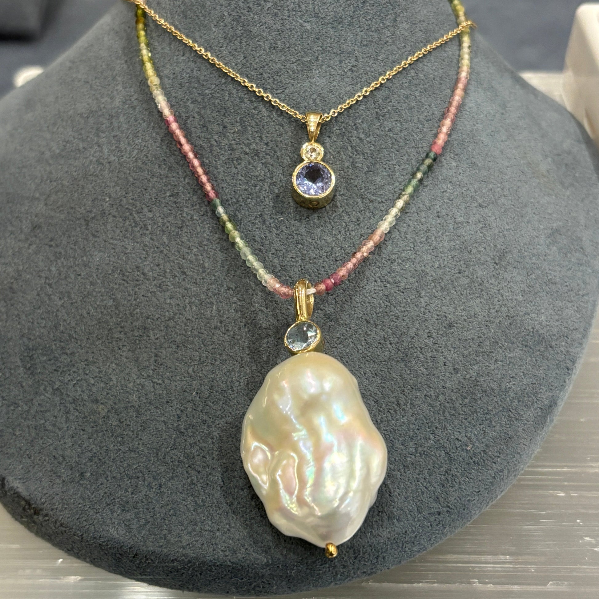 gold pendant with aquamarine and freshwater pearl