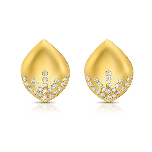 Gold earrings with diamond accents on a white background