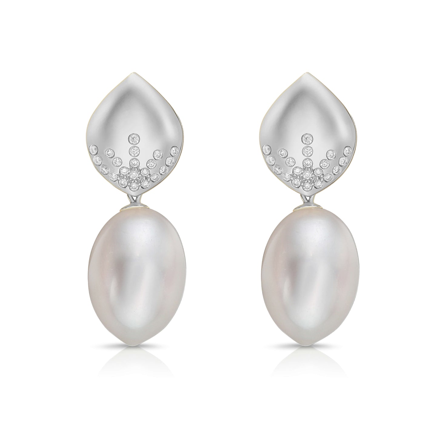 Pearl and diamond earrings on a white background