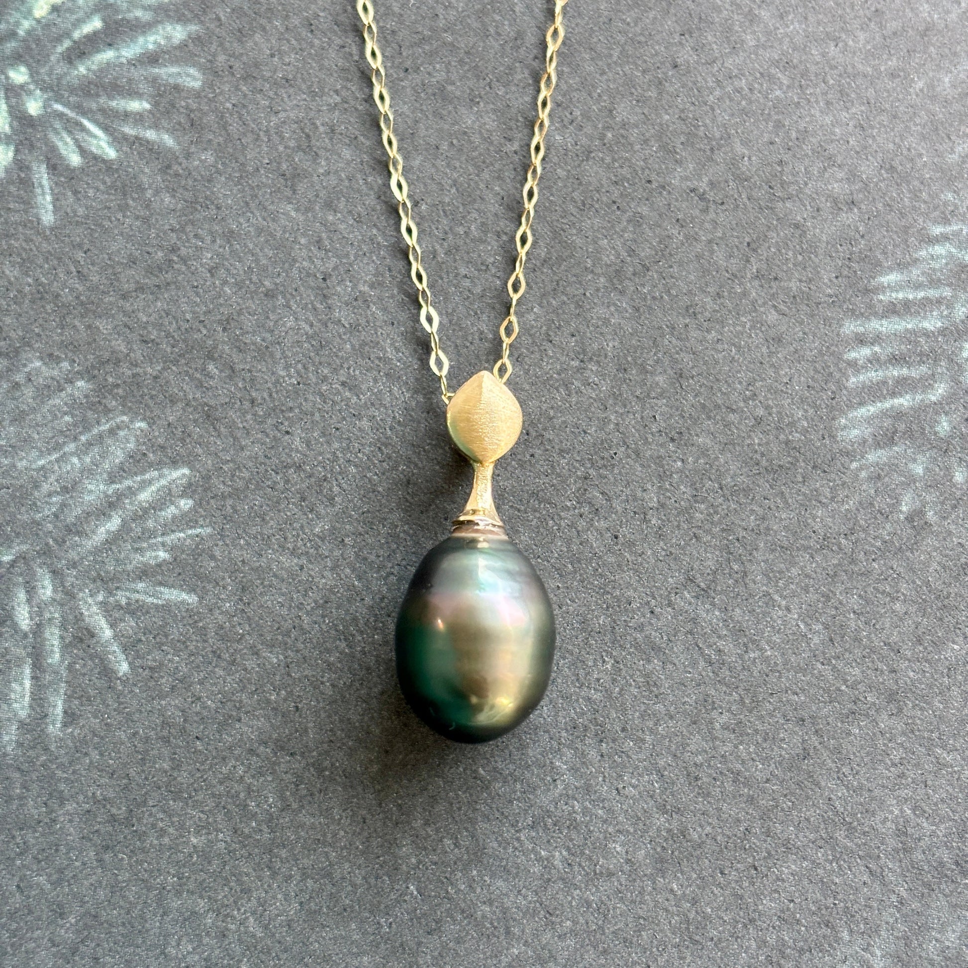 14K gold and dark Tahitian pearl pendant with hidden bail.