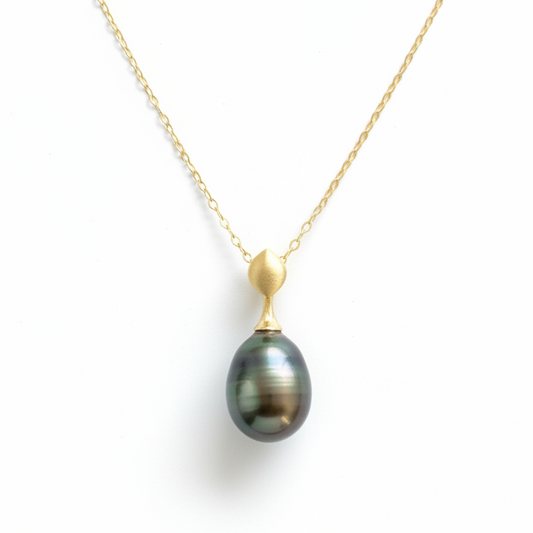 14K brushed gold and dark Tahitian pearl pendant with hidden bail.